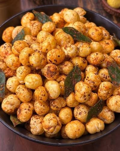 Real photo of classic masala roasted makhana with curry leaf tempering